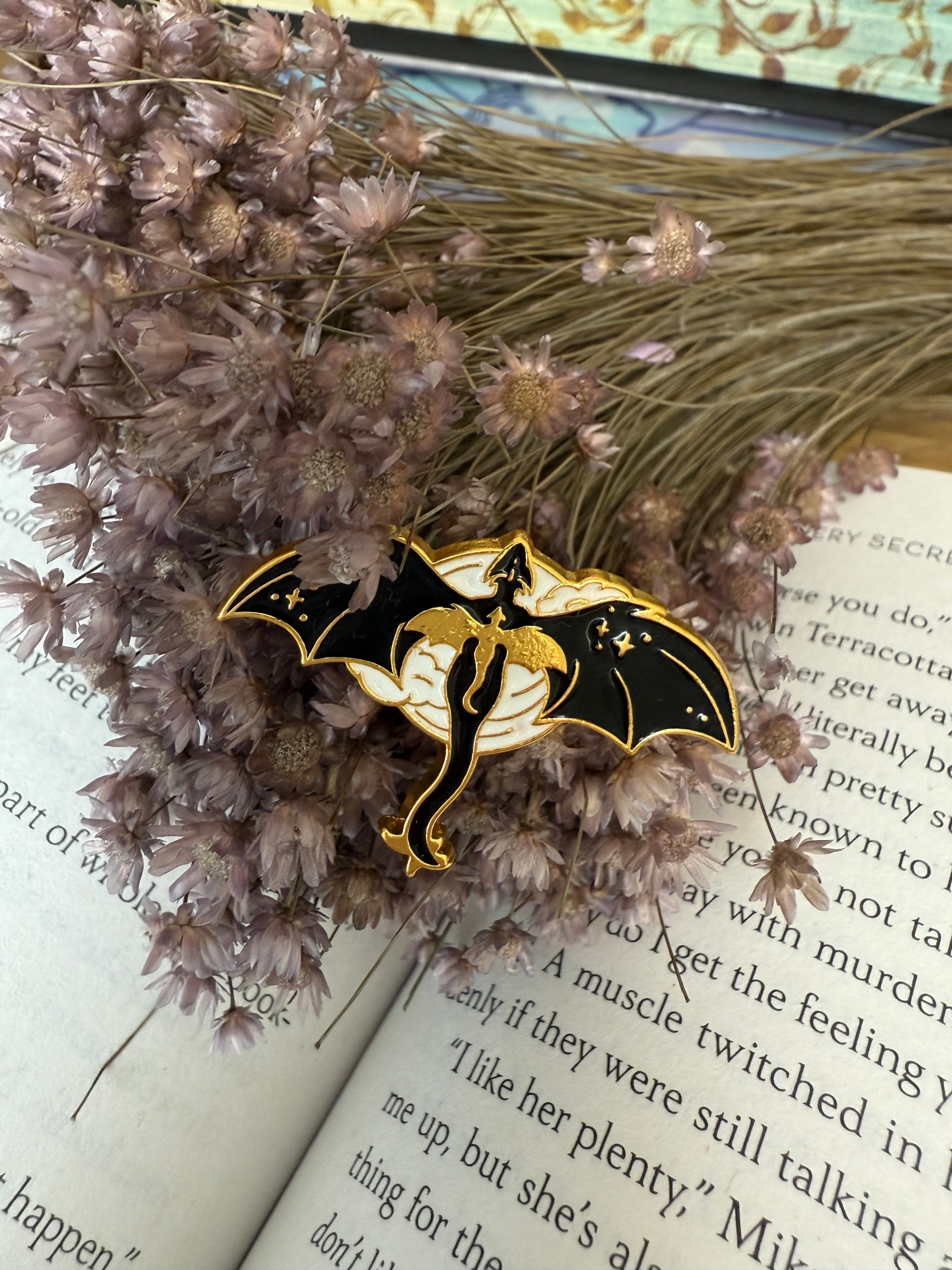 Gold and black pin dragon