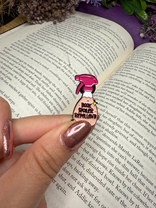 Book spoiler repellent pin