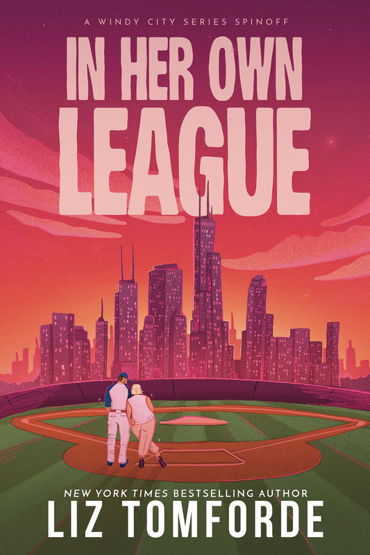 Cover of In Her Own League by Liz Tomforde: a couple on a baseball field against a pink Chicago skyline