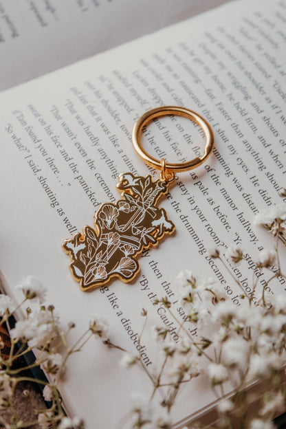 Ivory Sword Fantasy Reader Enamel Keychain