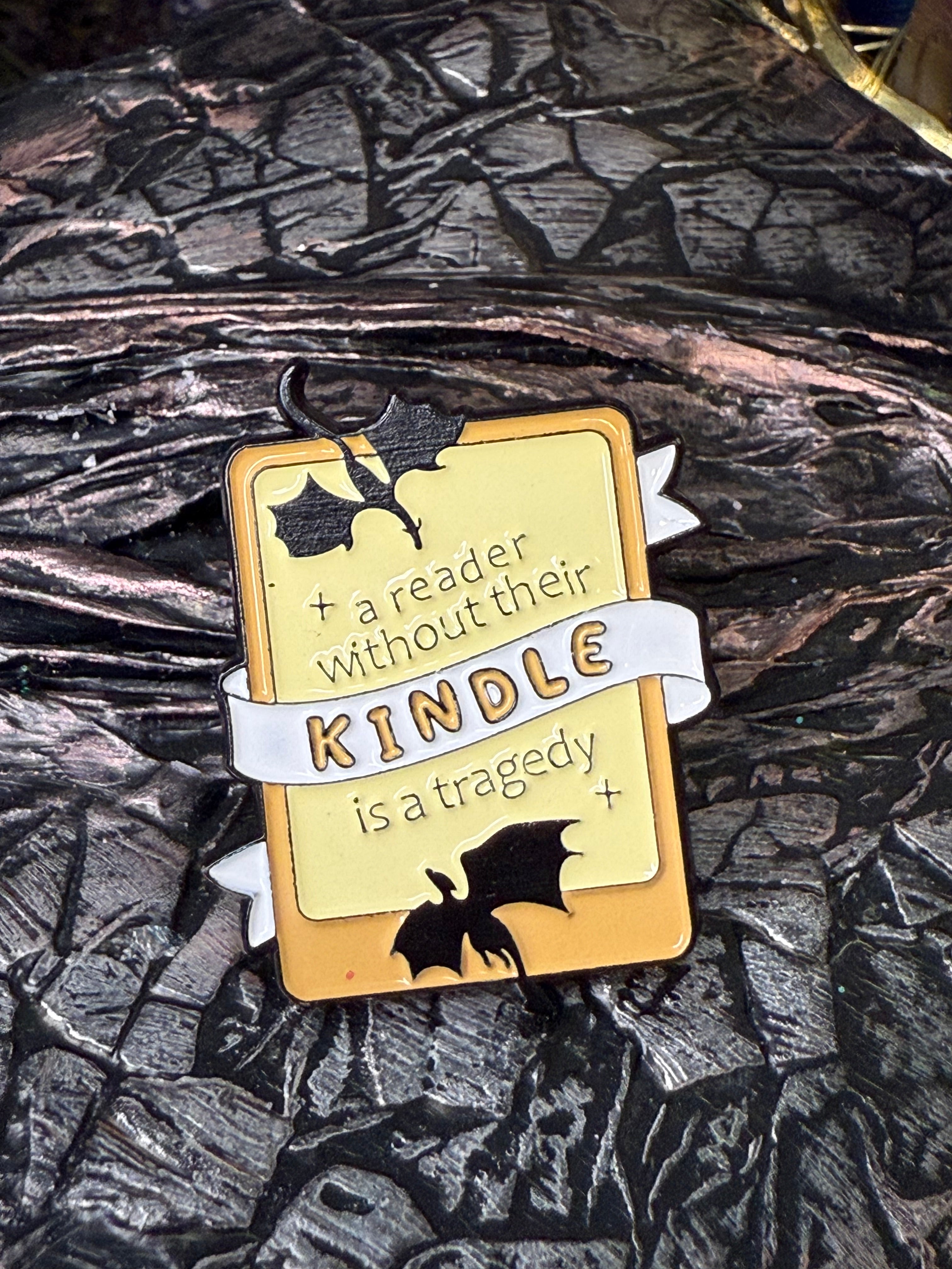A reader without their kindle is a tragedy pin