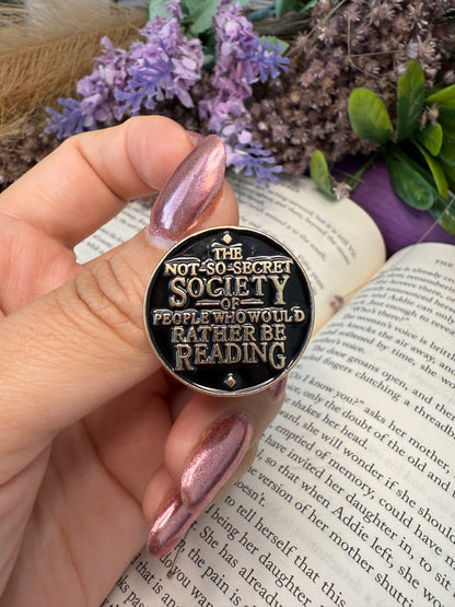 The not so secret society of people who would rather be reading. Enamel pin