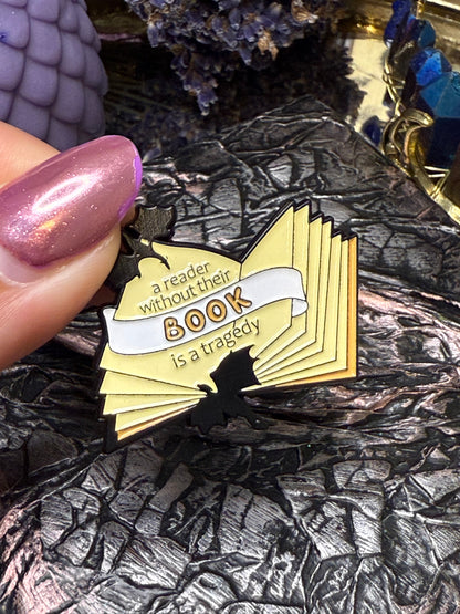 A reader without their book is a tragedy pin