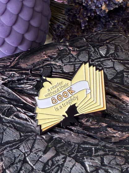 A reader without their book is a tragedy pin