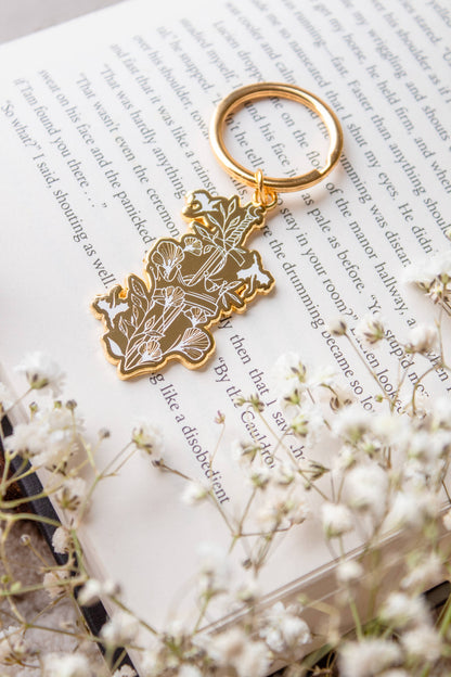 Ivory Sword Fantasy Reader Enamel Keychain